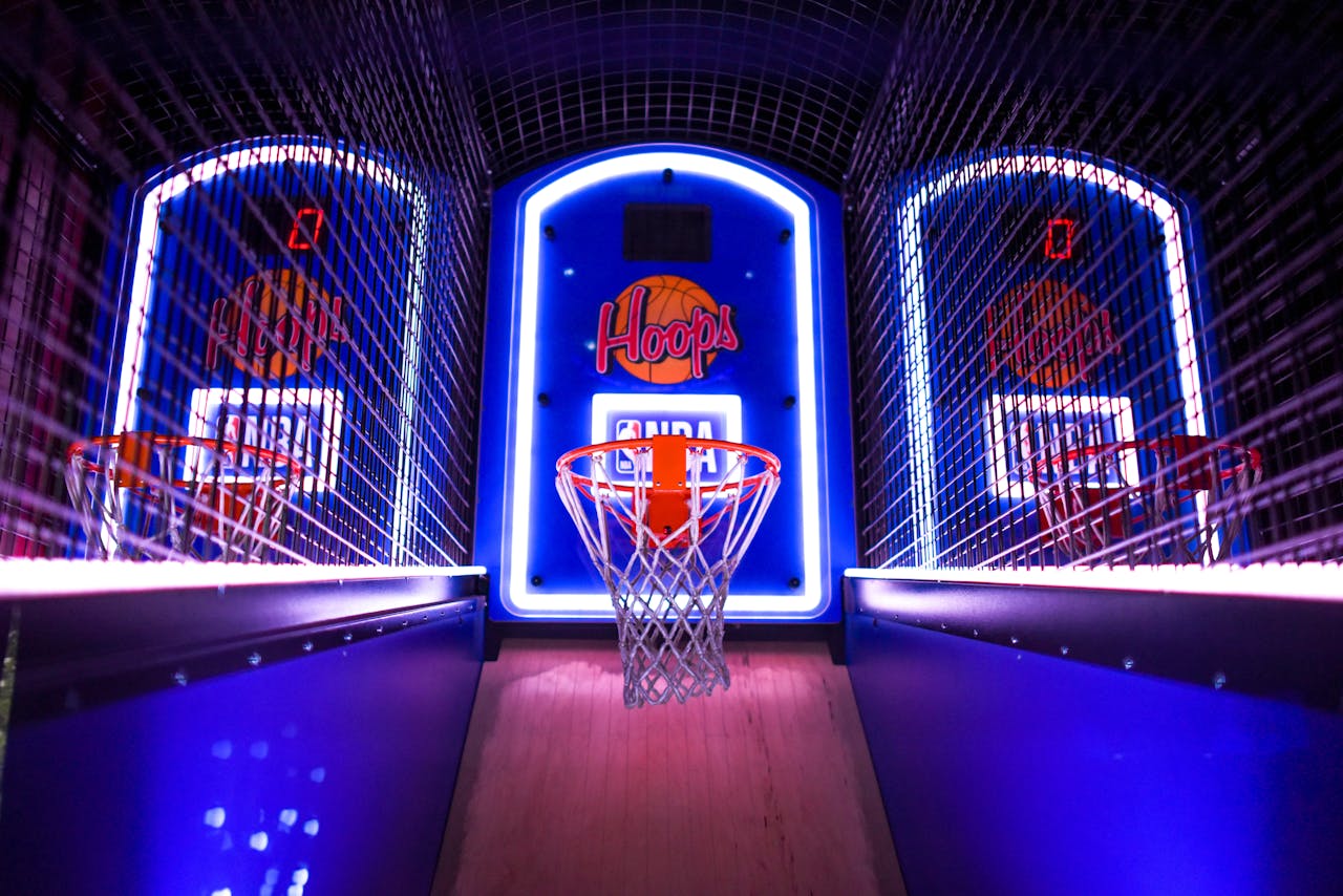 A colorful indoor arcade game showcasing basketball hoops in a vibrant setting, perfect for entertainment venues.