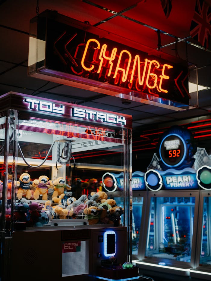 services-04 Engaging arcade scene featuring neon lights, claw machines, and a bustling atmosphere.