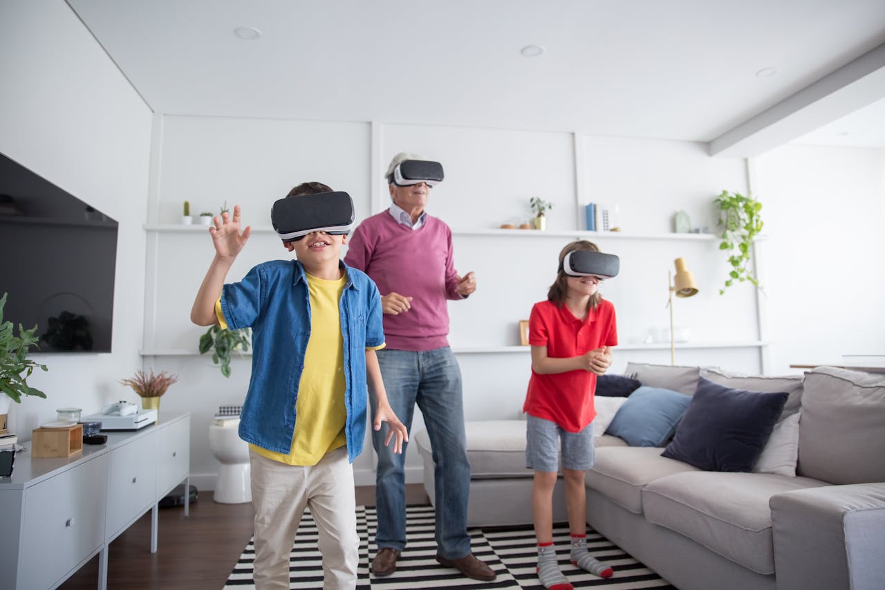 Three people using VR headsets in a living room, having fun with virtual reality.